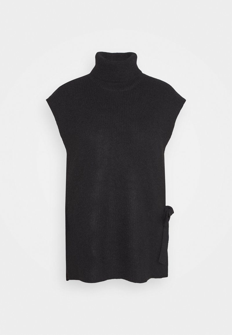 Pull sans manches noir en maille à col roulé avec détail de lien sur le côté et coupe ample sur fond gris clair uni.