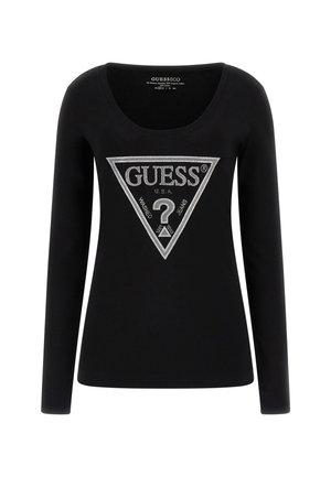 T-shirt nero a maniche lunghe con scollatura a barca. Presenta una grande grafica triangolare argentata con "GUESS U.S.A" e un punto interrogativo al centro.