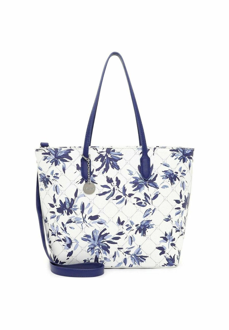 Sac cabas blanc avec motif floral bleu, anses bleues et bandoulière amovible, avec un charme rond en argent.