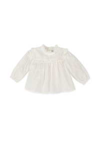 Blusa blanca de manga larga hecha de tejido ligero, con un escote con volantes, cuerpo fruncido y puños elásticos.