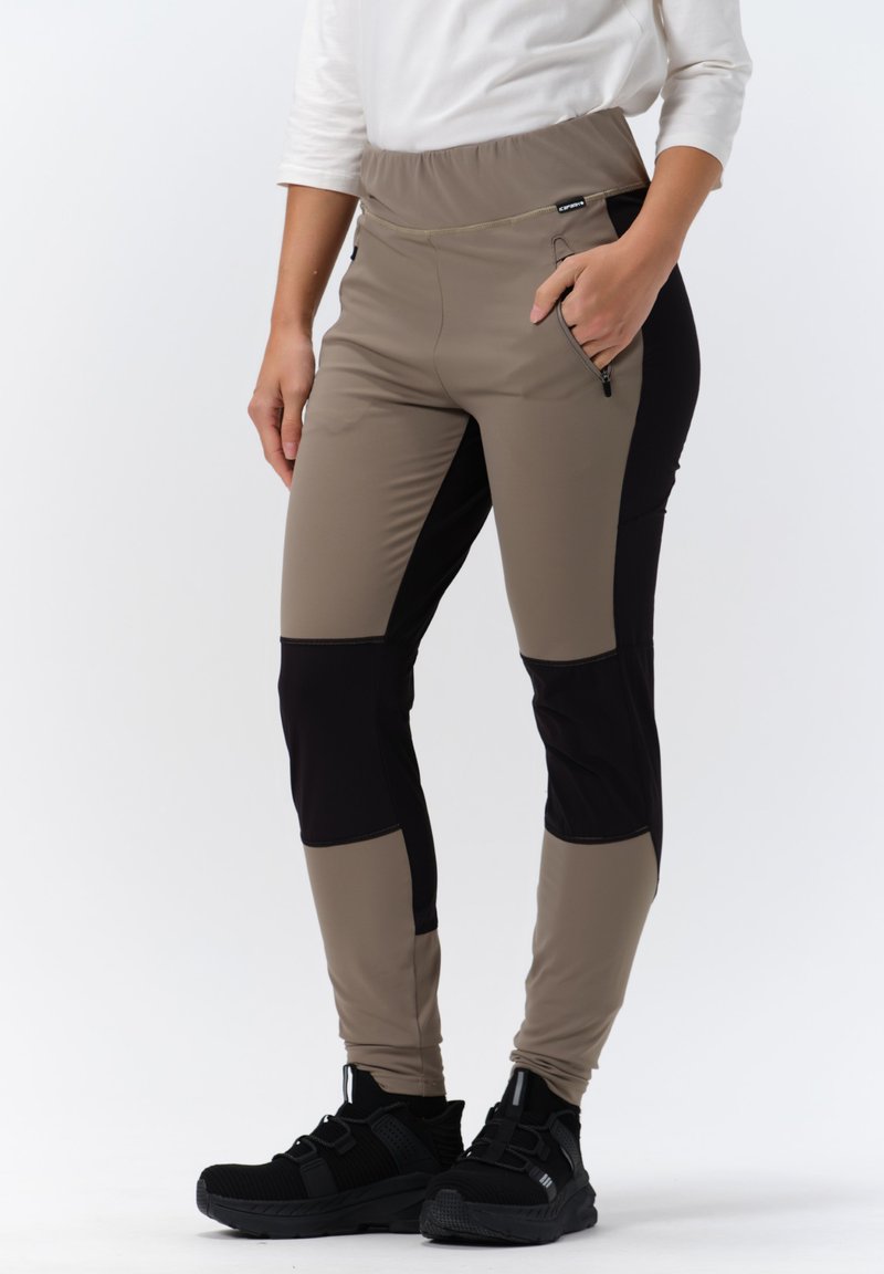 Brown and black stretch pants with an elastic waistband, zippered pocket, and a fitted design, featuring contrasting color panels.