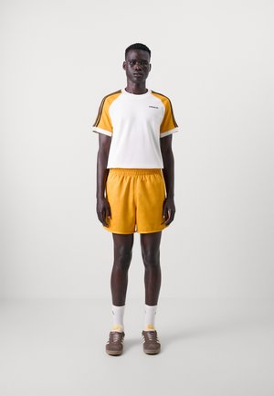 adidas Originals 80S SPRINT - Tracksuit bottoms - orange