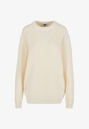 Pull en maille côtelée couleur crème avec un col rond, des épaules tombantes et une coupe décontractée ; il possède un tricot texturé et des poignets côtelés.