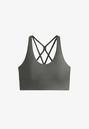 Urheiluliivit tummanoliivinvihreänä, valmistettu sileästä kankaasta. Siinä on leveä vyö ja ristikkäinen muotoilu takana. Ei pehmusteita tai tukikaaria.