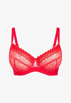 Reggiseno rosso in pizzo con coppe trasparenti, bordo in pizzo smerlato e spalline regolabili. Design strutturato con schiena solida e ganci regolabili.