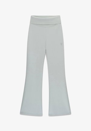 Jasnoszare, wysokie spodnie do jogi z rozkloszowanymi nogawkami i małym trójkątnym logo na prawym udzie.