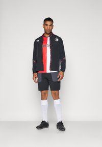 Castore FEYENOORD ROTTERDAM LEAGUE MATCHDAY ANTHEM JACKET - Klub merchandise - caviar/tomato