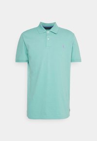 Tyrkysové polo tričko z bavlny, s klasickým límcem, dvouknoflíkovou légou a malým fialovým logem na levé části hrudi. Krátké rukávy.