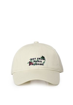 Casquette de baseball beige avec texte brodé "Not from Paris Madame" et petit dessin de vigne violette au centre devant.