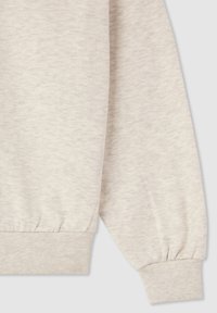 Felpa beige a maniche lunghe con polsini e vita elastici, realizzata in un tessuto morbido e leggermente strutturato.