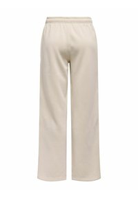 Beige Jogginghose mit lockerer Passform, elastischem Bund und glatter Textur. Sie hat gerade Beine und keine sichtbaren Muster oder Hardware.