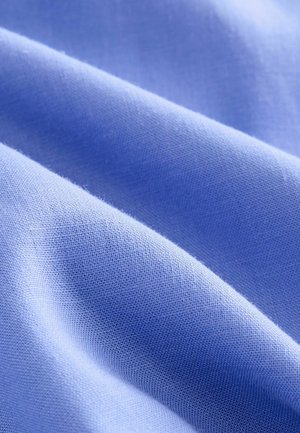 Light blue fabric with a smooth texture and fine weave, showing gentle folds and subtle variations in shade. Seamless and without patterns.