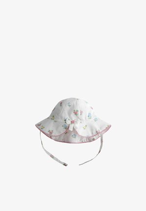 Chapeau de soleil blanc pour bébé avec petites fleurs roses, bleues et jaunes, bordure rose, nœud sur le côté et brides sous le menton pour un maintien sécurisé.