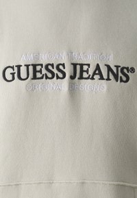 Guess Jeans HOOD REG AMERICA TRAD - Felpa - biscotti
