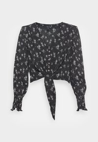 Blusa nera floreale con maniche lunghe a sbuffo, chiusura con bottoni e un nodo in vita. Presenta un tessuto strutturato con piccoli fiori bianchi.