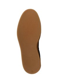 Sola di una scarpa realizzata in gomma con una finitura texturizzata di color miele. Presenta un contorno liscio e delicate scanalature a motivo per garantire grip.