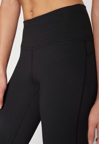 Champion PERFORMANCE FLARE LEGGINS - Leggingek - black