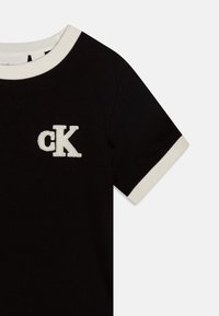 Calvin Klein Jeans Triko s potiskem - black