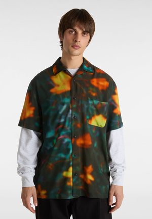 Short-sleeve shirt with a dark floral print, featuring orange and yellow leaves on a green background, a button front, and a chest pocket.