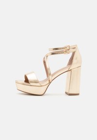 Sandale s visokom petom - gold