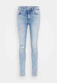 Light blue skinny jeans made of denim, featuring distressed patches on the knees and a fitted design. Standard five-pocket styling.