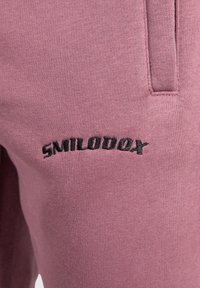 Smilodox MERRICK - Træningsbukser - violett
