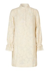 Vestido de color crema con estampado floral, cuello alto, botonera y mangas largas con puños fruncidos que presentan detalles de pompones.