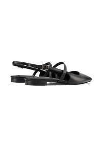Pantofole slingback nere con punta appuntita, caratterizzate da cinturini incrociati e un accento testurizzato. Materiale in pelle liscia, tacco basso a blocco.