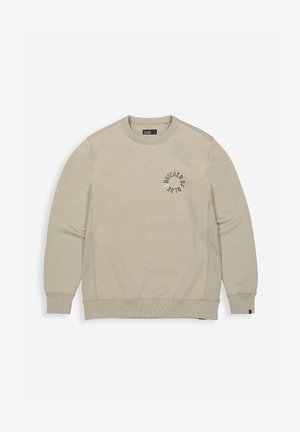 Beige sweatshirt met een ronde halslijn, ribgebreide mouwen en zoom. Heeft een circulair logo met de tekst "BUTCHER OF" op de linkerborst in een donkere kleur.
