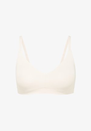 Soutien-gorge sans fil beige clair avec de fines bretelles réglables, en tissu doux, doté d'une surface lisse et d'un décolleté arrondi, sans armature ni rembourrage.