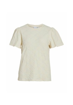 Krems krāsas īsām piedurknēm tops ar strukturētu ģeometrisku rakstu, apaļu kakla izgriezumu un savelkamiem piedurkņu galiem, nodrošinot strukturētu piegriezumu. Izgatavots no mīksta auduma.