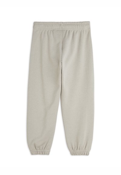 Light gray sweatpants with a textured fabric, elastic waistband, and fitted elastic cuffs at the ankles. Simple design without pockets.