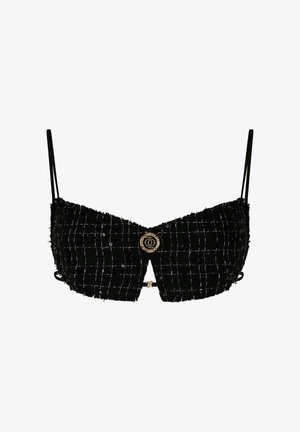 Black cropped bralette with a textured fabric featuring a checkered pattern, adjustable straps, and a round gold-tone embellishment at the center.