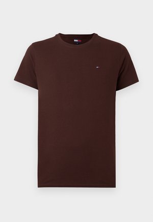T-shirt à col rond, à manches courtes, de couleur brun foncé uni, avec un petit logo rectangulaire sur le côté gauche de la poitrine et une étiquette à l'intérieur du col.