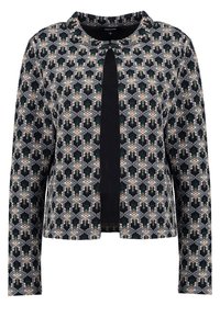 Textured crop jacket with long sleeves, featuring a geometric pattern in dark green, beige, and black, with a solid black front panel.