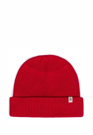 Red knitted beanie with a ribbed texture and fold-over cuff. Features a small branded label on the side.
