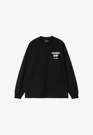 T-shirt in cotone nero a maniche lunghe con polsini a coste e scollatura rotonda. Presenta la scritta bianca "CARNIVAL WIP" e "©1989" sul lato sinistro del petto.