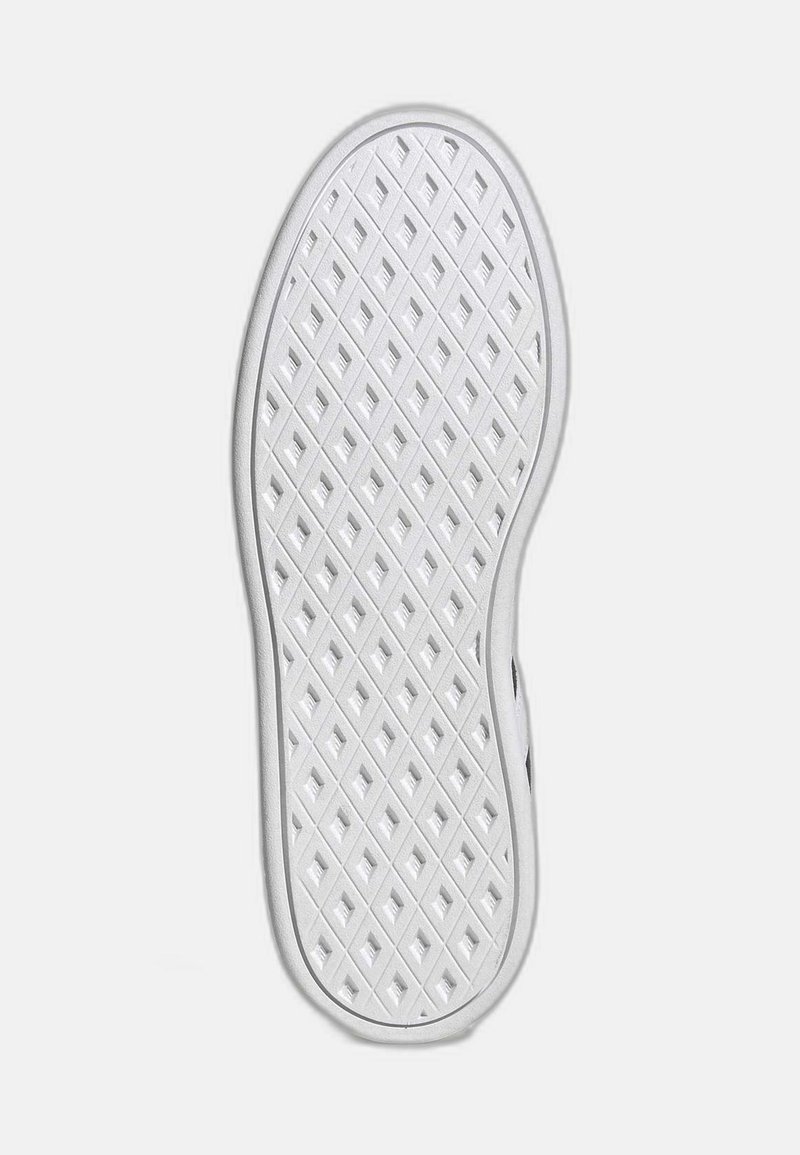 Suela de zapato de goma blanca con un patrón de diamante para tracción, con un acabado suave y bordes redondeados.