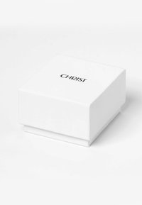 Scatola di gioielli bianca con una finitura liscia, caratterizzata da un logo nero "CHRIST" sulla parte superiore, forma quadrata e design con coperchio scorrevole.