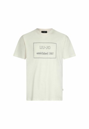 T-shirt in cotone color crema chiaro con maniche corte. Presenta un'etichetta grafica rettangolare con cuciture in contrasto che dice "LIU·JO established 1995."