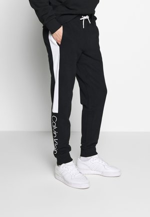 Pantalones deportivos - black