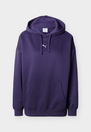 Lilla hettegenser med kengurulomme, hvit Puma-logo på brystet, justerbar snor i hetten, og ribbestrikkede mansjetter og nederkant. Mykt materiale.