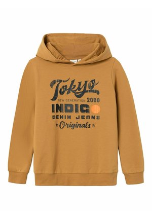 Brun hættetrøje med sort og orange tekst, der lyder "Tokyo New Generation 2000 INDIGO Denim Jeans Originals" på forsiden.