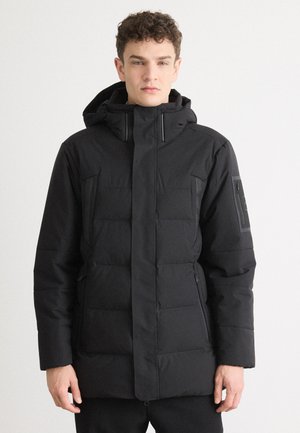 Black insulated jacket with a hood, featuring quilted texture, zippered pockets, and a straight cut. Smooth fabric with minimal detailing.