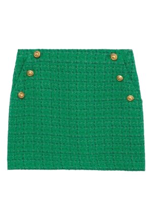 Mini-jupe texturée verte avec six boutons décoratifs dorés sur le devant, disposés en deux rangées verticales près des côtés.