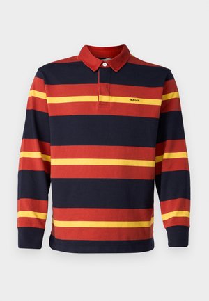 Långärmad polo skjorta med marinblå, röd och gul horisontella ränder, med krage och Gant-logotyp på bröstet.