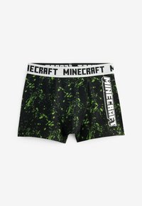 Boxeri negri cu un model de stropi verzi, având un brâu alb cu textul "MINECRAFT" imprăntat cu litere îngroșate și rezistente.