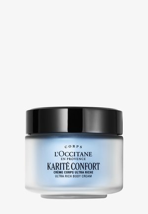 Crema corpo ultra ricca Karité Confort di L'Occitane in vasetto di vetro satinato con coperchio nero e testo sull'etichetta blu e bianco.