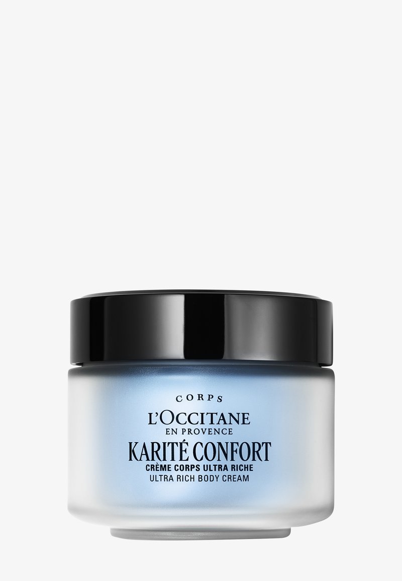 Crema corpo ultra ricca Karité Confort di L'Occitane in vasetto di vetro satinato con coperchio nero e testo sull'etichetta blu e bianco.