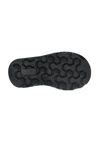 Suela de zapato de goma negra con patrón de relieve hexagonal, que presenta secciones elevadas para tracción y un borde liso. Incluye una sección rectangular para la estabilidad del diseño.